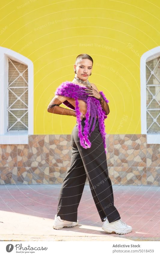 Androgynous man in expressive outfit standing on street androgynous queer eccentric feminine gay lgbt homosexual male transgender city trendy style urban lgbtq