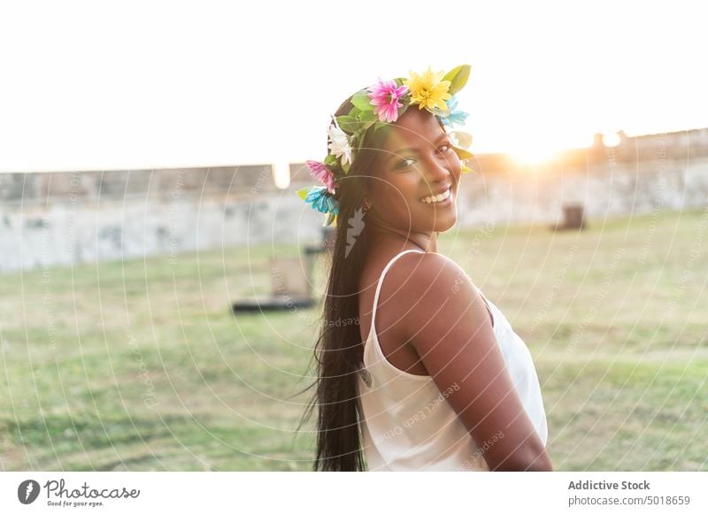 Charming ethnic woman in flower wreath in summer floral charming tender colorful natural female bloom fresh blossom nature content romantic feminine appearance