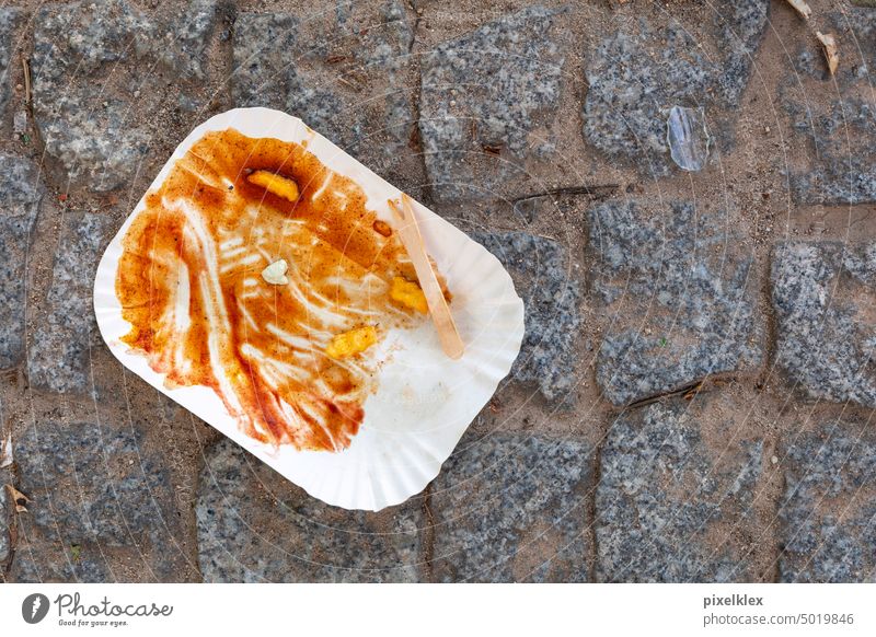 Paper plate with remains of French fries, ketchup and an old chewing gum, Berlin paper plates Plate Chewing gum Fast food Trash Waste management Street waste