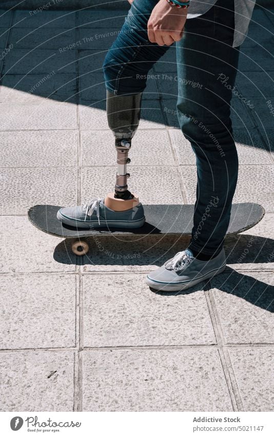 Man with artificial leg riding skateboard man ride determination motivation dynamic wall street amputee city exterior young concrete energy urban male