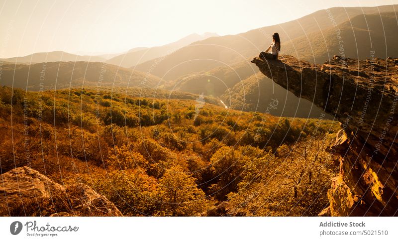 Woman admiring highlands from viewpoint woman mountain admire morning nature cliff traveler landscape pyrenees edge rock observe freedom picturesque tourism