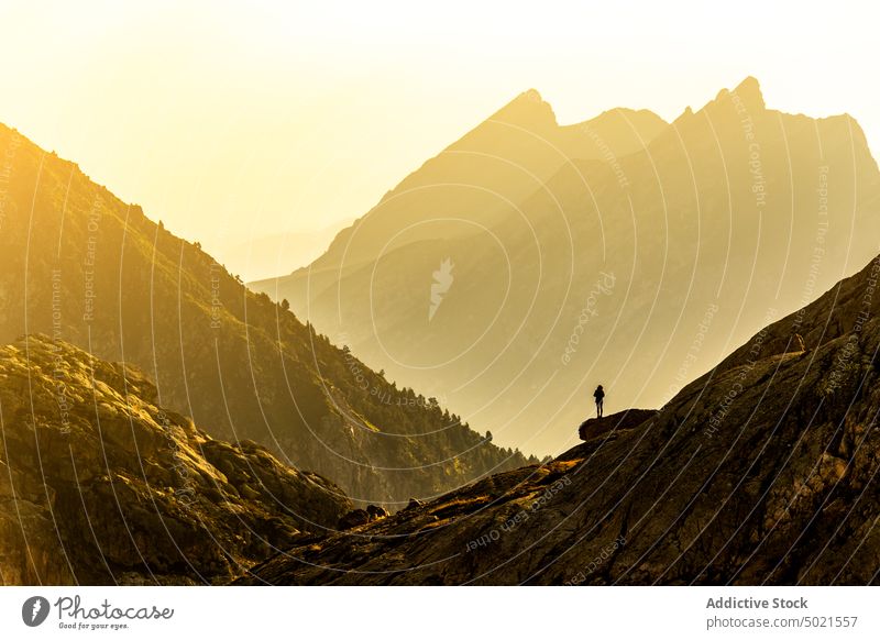 Anonymous woman admiring highlands from viewpoint mountain admire morning nature cliff traveler landscape pyrenees edge rock observe freedom picturesque tourism