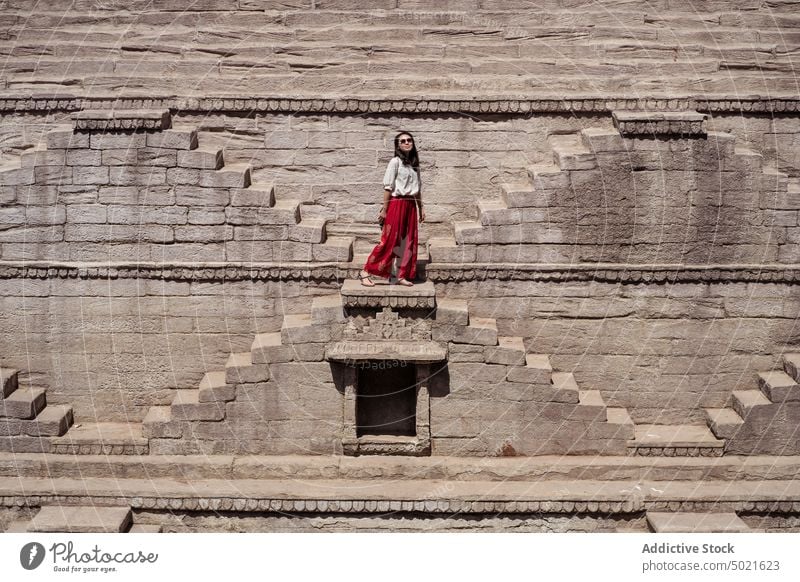 Traveling woman in Toorji Ka Jhalra on sunny day toorji step ethnic travel toorji ka jhalra tourist sightseeing well asian holiday landmark female jodhpur india