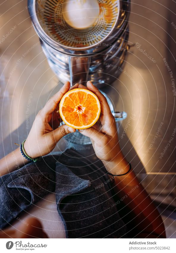 Bartender making fresh citrus juice at table woman bartender drink beverage fruit lemon healthy restaurant natural refreshment nutrition diet raw person cafe