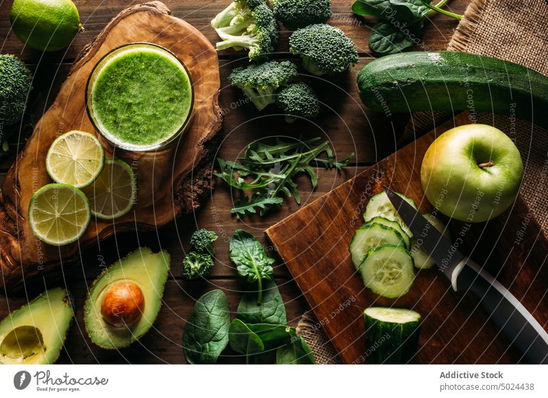 Ingredients for a detox juice apple avocado blade broccoli citrus fruit color cooking cucumber desktop diet dining table food freshness from above furniture