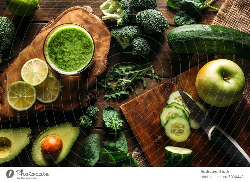 Ingredients for a detox juice apple avocado blade broccoli citrus fruit color cooking cucumber desktop diet dining table food freshness from above furniture