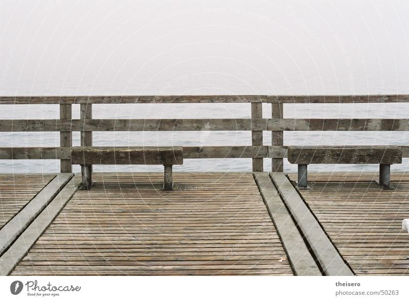 outlook into nothing Ocean Water Horizon Autumn Bad weather Fog Coast Baltic Sea Bridge Tourist Attraction Wood Dark Gloomy Loneliness Sea bridge Bench Empty