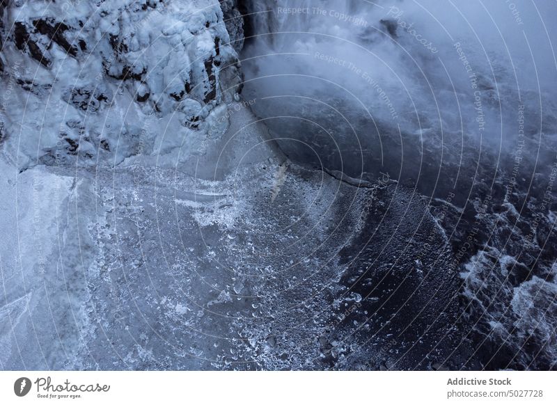 Frozen lake in mountains in winter ice glacier frozen nature north background geology slope cold environment weather rough season scenic snow arctic abstract