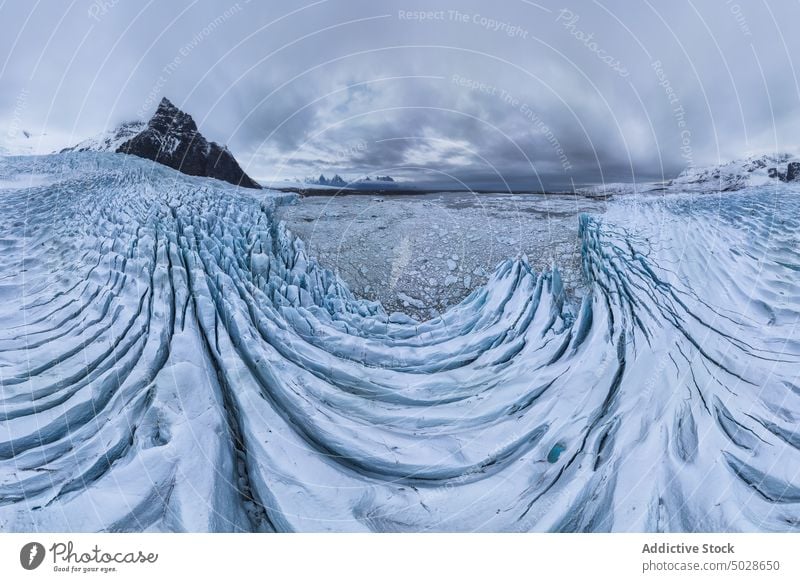 Snowy rocky mountains on winter day snow landscape scenery glacier range nature ridge fjallsarlon vatnajokull iceland breathtaking cloudy frozen highland