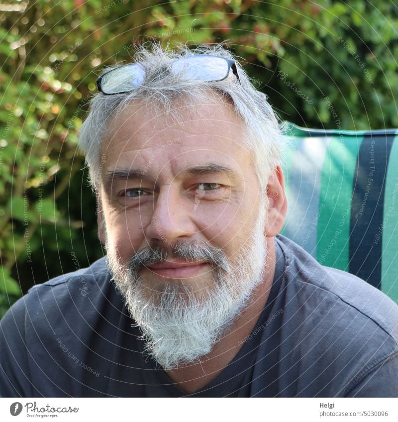 Portrait of middle aged man with gray beard, gray hair and glasses on head Human being Man portrait Head Face Gray-haired Facial hair Short-haired Eyeglasses