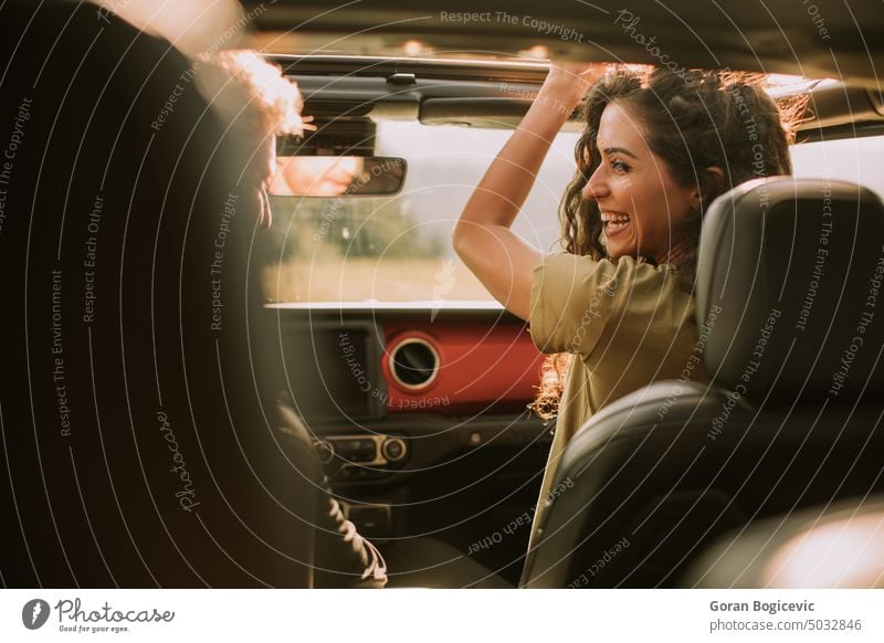 Couple having fun on roadtrip couple woman two vehicle automobile car together nature transport lifestyle driver travel male love young happy togetherness guy