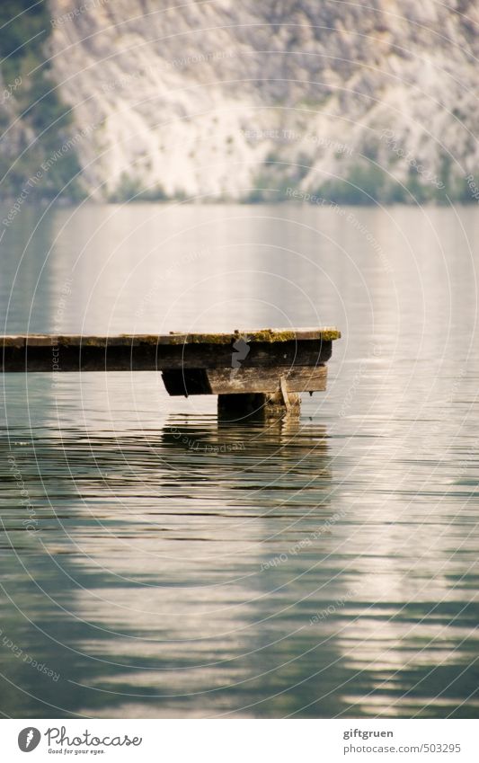 silence Environment Nature Elements Water Rock Mountain Lakeside Swimming & Bathing Footbridge Wood Surface of water Calm Peaceful Steep face Wall of rock