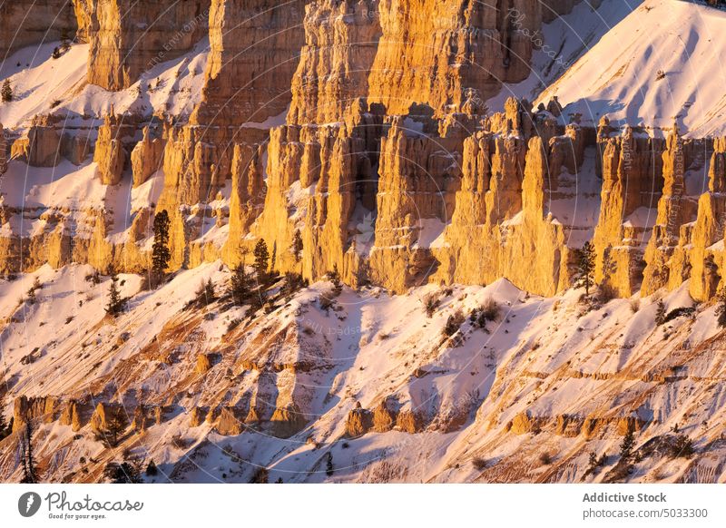 Rocky formations in mountainous terrain snow landscape rocky picturesque hoodoo bryce canyon national park nature winter desert natural tourism geology