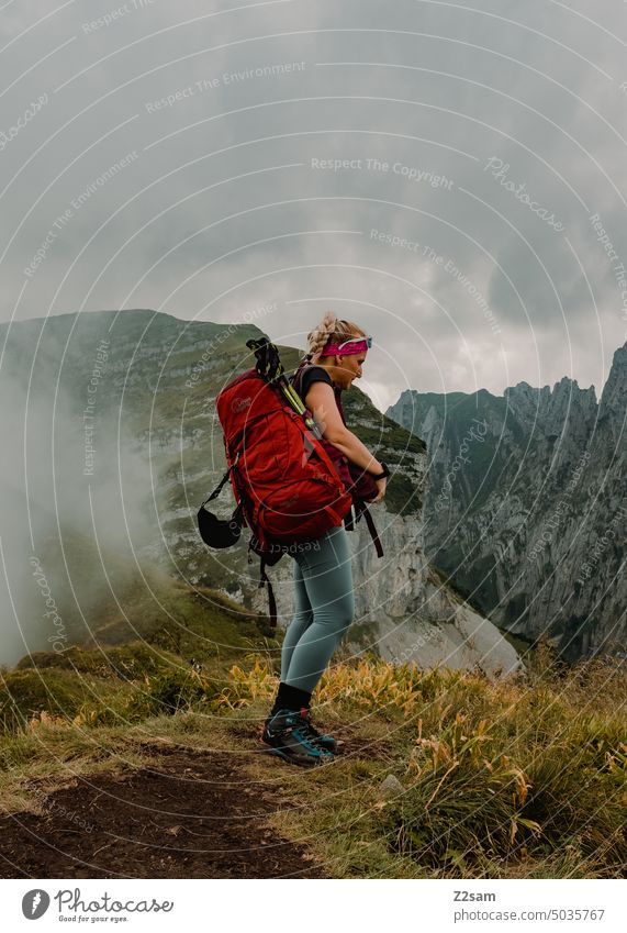 Hiker in the Alpstein hüttntour Switzerland Hiking appenzellerland mountains Colour photo Exterior shot Environment Vacation & Travel Green Haze Summer Sun