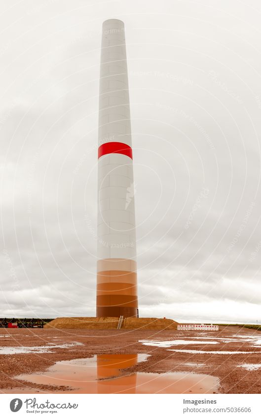 Construction and assembly of a construction wind turbine without rotor and rotor blades. Construction work on the wind farm. Energy saving concept from wind turbine construction