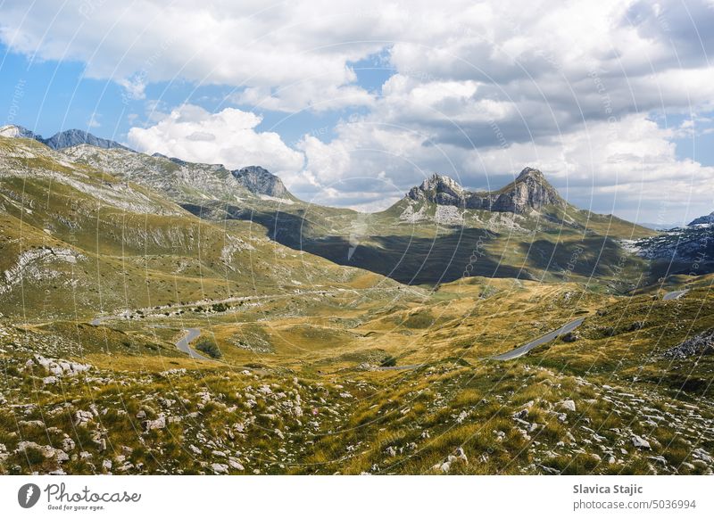 Durmitor National park, Montenegro. Durmitor mountain pass Sedlo road  and blue sky idyllic late summer landscape alpine asphalt autumn background balkan