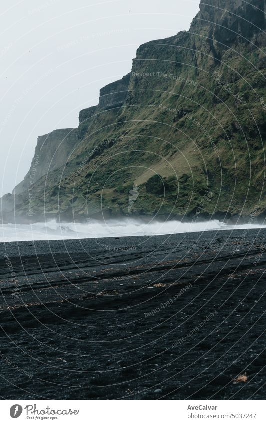 Black sand beach in Iceland during a rainy day. horizontal majestic photography famous place iceland nature outdoors travel destinations black sand coastline