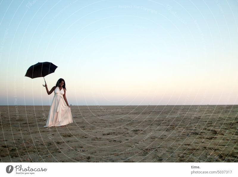 Woman with umbrella in white dress in evening on beach Umbrellas & Shades Dress Beach Relaxation Nature coast Sand Vacation & Travel Sunlight Horizon Dusk