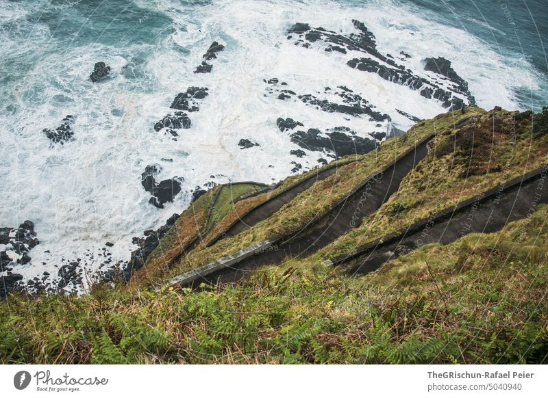 Steep road on a cliff Street Lanes & trails Cliff Water Waves White crest salt water Bad weather slope coast Ocean Exterior shot Landscape