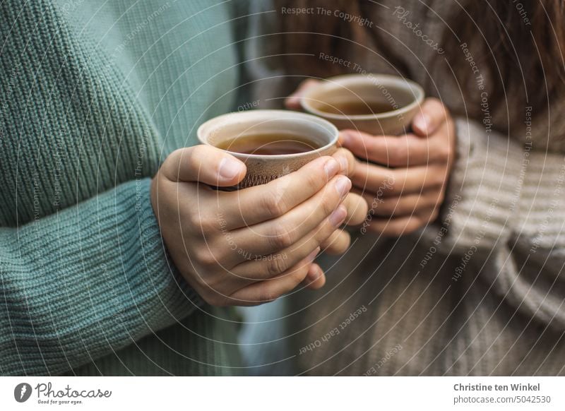 First warm up... hands teacups To hold on in common Hot drink hot tea warming Warm up chill Sweater Autumn To enjoy Beverage cold season Winter Tea Mug Cozy