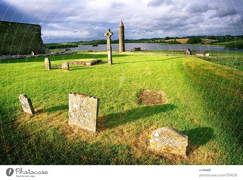 Cemetery on Derwenish Island Northern Ireland Manmade structures Ruin Wall (barrier) Clouds Summer Grave Meadow Green Celtic cross Celts Christianity