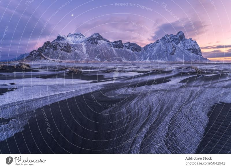 Snowy mountains near frozen lake landscape nordic scenery spectacular Iceland snow Stockness nature sunset range sky Vestrahorn beach evening winter calm