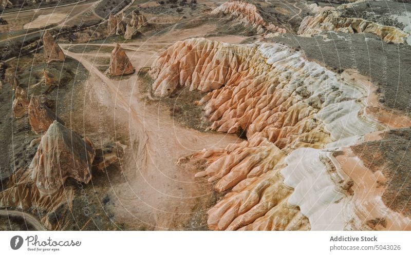 Scenic landscape of rough rocky mountains under cloudy sky valley nature breathtaking formation highland geology ridge picturesque range scenery observe