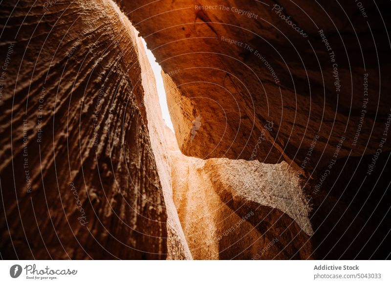 Rocky formations in canyon on sunny day cave rocky nature volcanic sandstone cliff geology uneven rough massive picturesque scenic sunlight cappadocia turkey