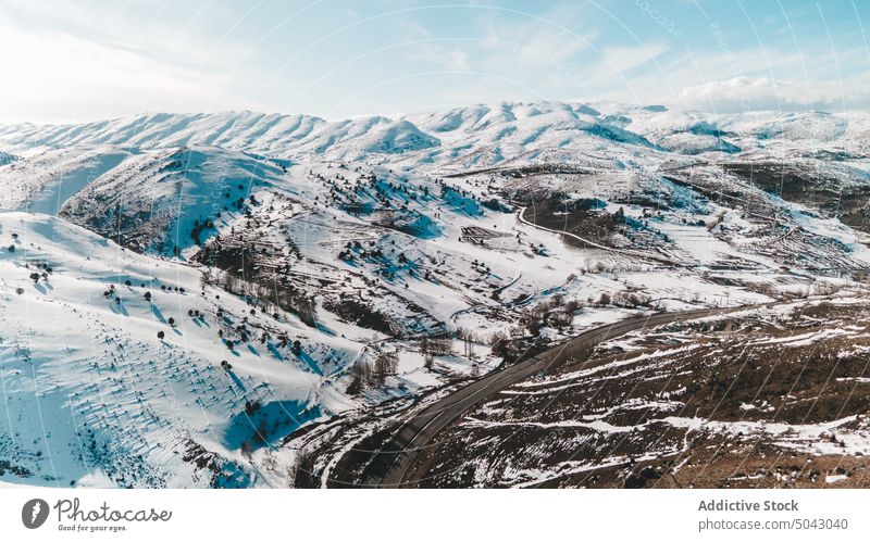 Road near snowy mountains in daytime winter road valley blue sky cloudy slope cold breathtaking turkey weather ridge ski resort nature way terrain scenic route