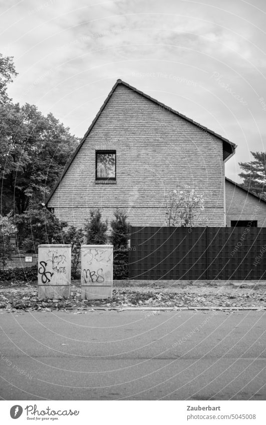 Asymmetrical facade of a family house with two fuse boxes in black and white Facade Apartment Building Detached house asymmetric factual Objectivity