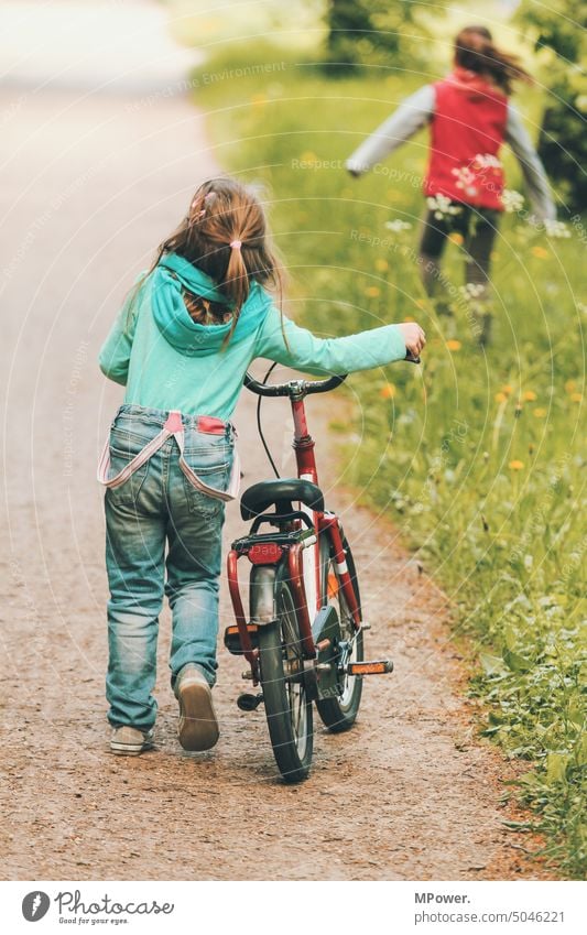 Kids on the road children Girl Bicycle Playing In transit explore Discover Green Grass Lanes & trails Trip Cycling Leisure and hobbies Infancy Childhood memory