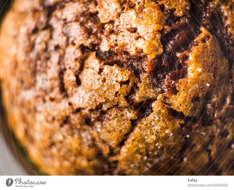 Banana chocolate muffin with caramel sugar topping bake cake macro closeup banana texture dark tray bakery product cook sweet food dessert treat home made nut