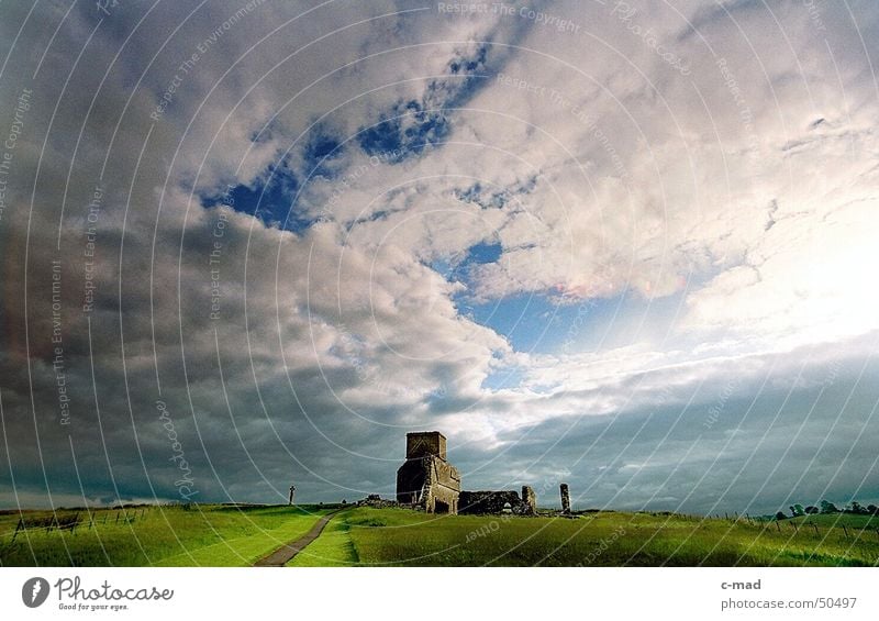 Derwenish Island in the evening Northern Ireland Manmade structures Ruin Celts Cemetery Grave Clouds Summer Green Back-light Wide angle River Tower