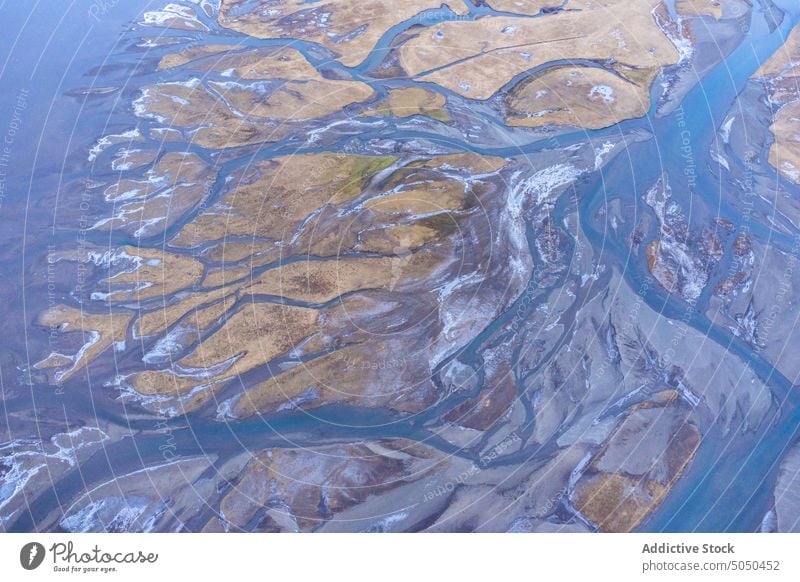 Aerial breathtaking view if river estuary in nature valley wetland countryside landscape water scenic terrain iceland season surface stream flow picturesque