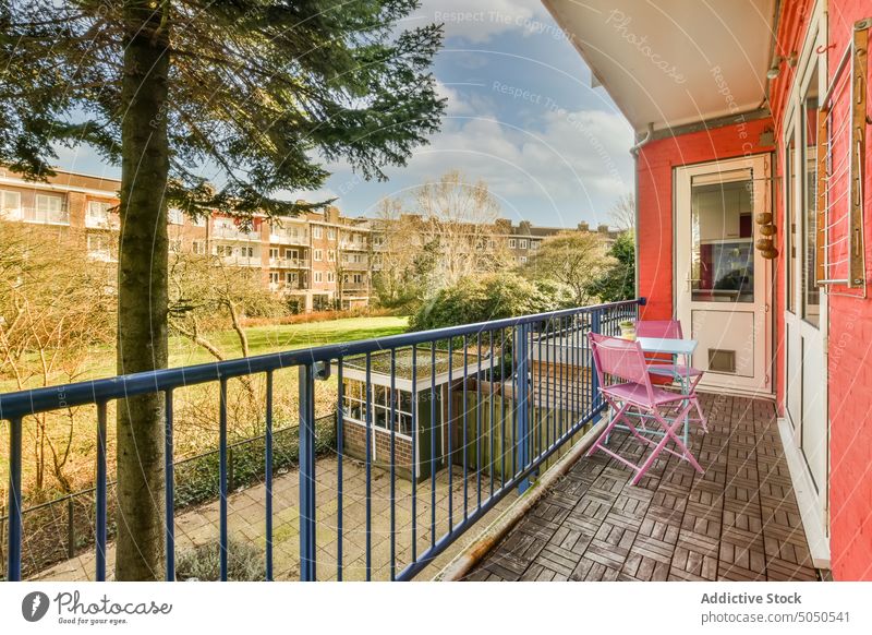 Balcony against residential buildings in city balcony terrace street design style neighborhood housing dwell property apartment town estate real estate light