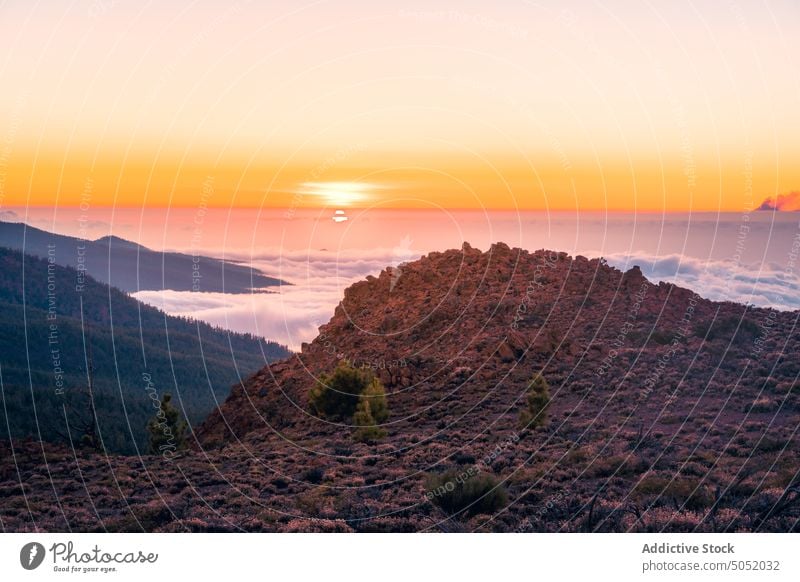 Picturesque view of high mountains and sea during sunset scenery breathtaking rocky sundown cloud nature tenerife spain canary islands thick cliff landscape