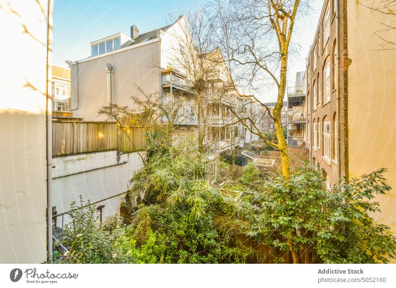 Balcony against residential buildings in city balcony terrace street design style neighborhood housing dwell property apartment town estate real estate light