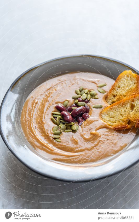 Healthy pumpkin soup with beans healthy autumn dinner cream bowl seeds meal squash lunch cuisine butternut coconut vegetable vegetarian vegan thanksgiving