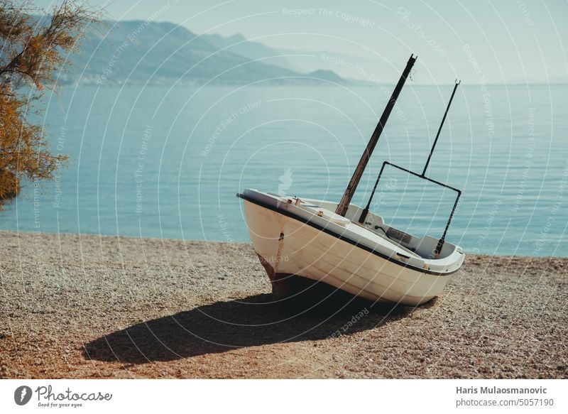 wooden boat alone on sea shore in the morning adriatic adriatic beach adriatic coast beautiful blue croatia empty fishing holiday island landscape nature ocean