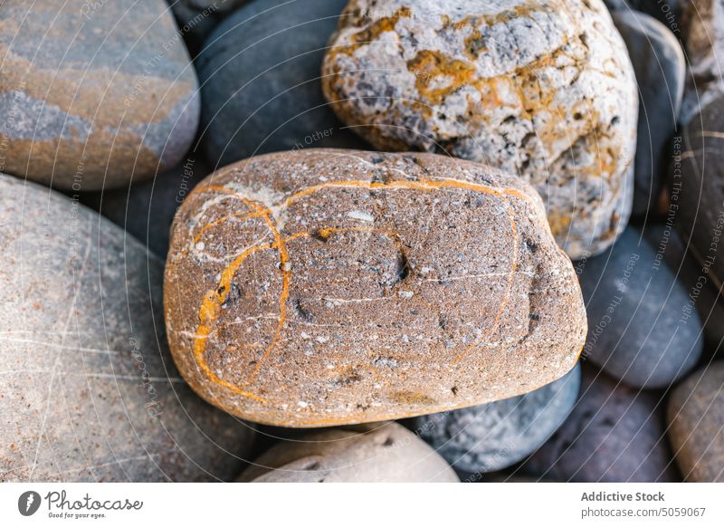 Smooth pebbles on beach in daytime stone sunlight summer seashore smooth nature surface background alkolea beach mutriku gipuzkoa spain rock coast geology