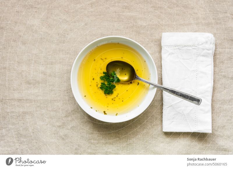 A plate of soup on a linen tablecloth. Top view, fasting. Soup Plate Diet Fasting Nutrition Colour photo Food Organic produce Vegetarian diet Healthy