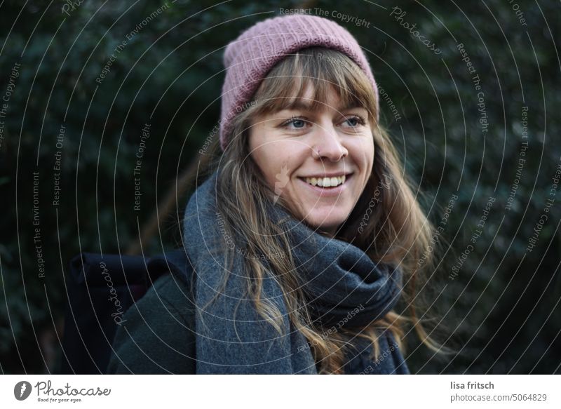 YOUNG WOMAN - CAP - SMILE Woman 25-29 years Cap Bangs Looking away Scarf Winter naturally Blonde Adults Exterior shot Colour photo Smiling pretty