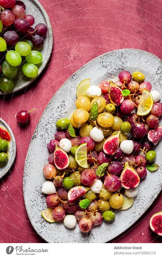 Grapes and olives salad kitchen vegetarian table cheese recipe grapes mozzarella leaves fresh ingredients food meal cuisine healthy seasoning savory nutrition