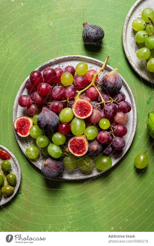 Wooden tray with ripe fruits grape red fresh bunch fig sweet food healthy food natural organic season vegetarian dessert vitamin rustic harvest refreshment