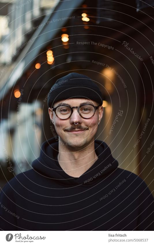 GRIN - MAN - GLASSES Man Eyeglasses Nose ring mustache hoodie Cap Fairy lights Cool (slang) Adults Facial hair Exterior shot Colour photo