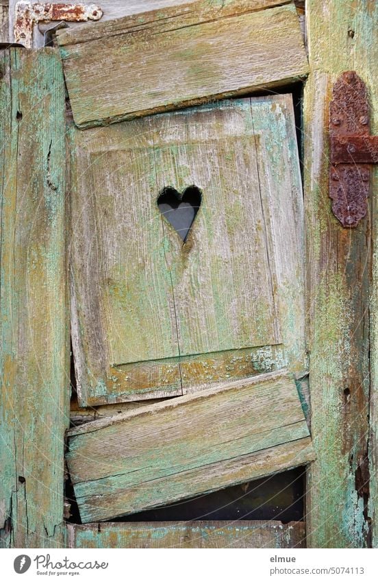 old broken wooden shutter with a recessed heart Shutter Heart sweetheart Wood dwell dilapidated leave blank Window Broken Old disintegrate Change Transience