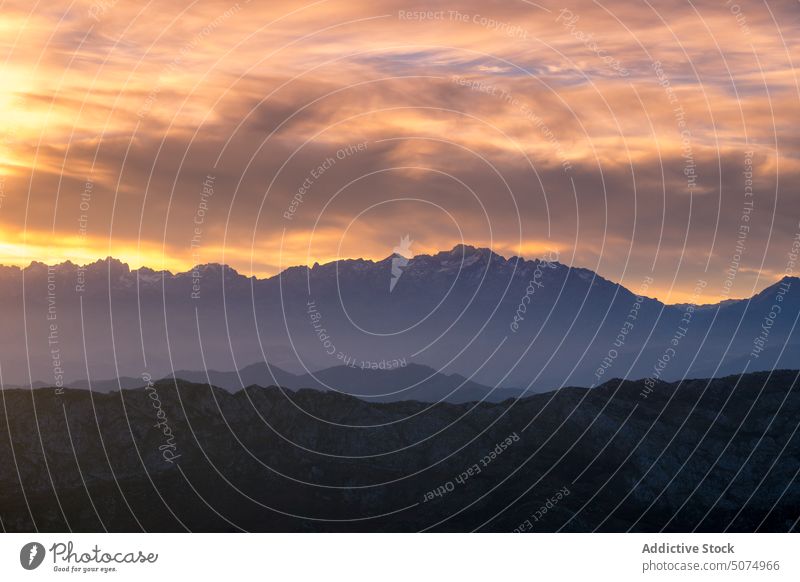 Cloudy sky over high mountains in Asturias peak highland nature landscape ridge range picturesque cloudy asturias sunset scenery scenic environment sundown