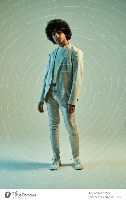 Stylish Hispanic man with Afro hairstyle suit afro model independent modern outfit character individuality male young hispanic ethnic smart casual curly hair