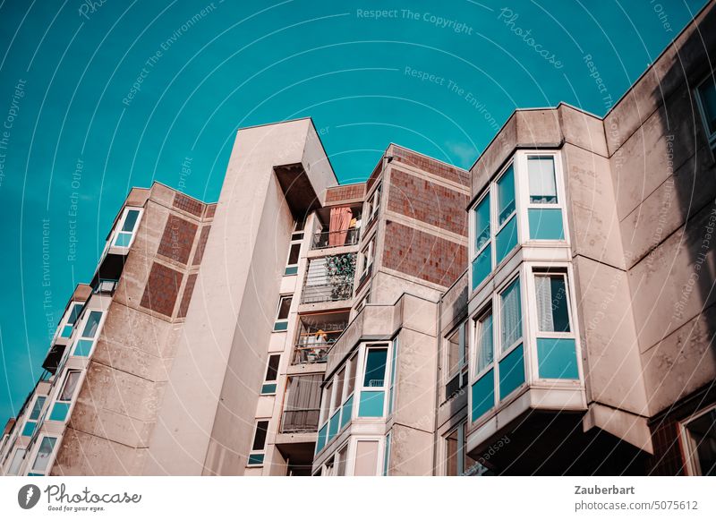 Prefabricated apartment buildings, plunging lines, neon blue sky Apartment Building Prefab construction housing public housing Sky Blue Balcony Sun Sunlit