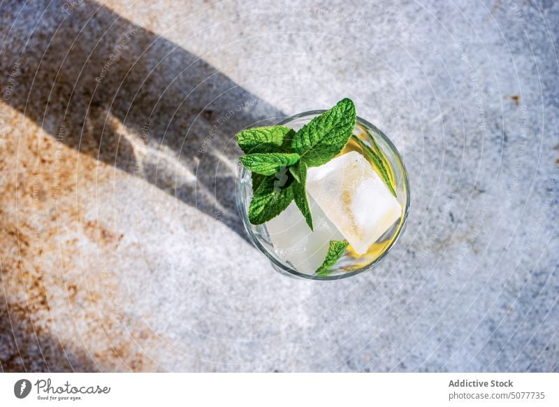 Glass of lemon water with mint background beverage cocktail day diet dieting drink fresh glass healthy lemonade lifestyle organic refreshment ripe served shadow